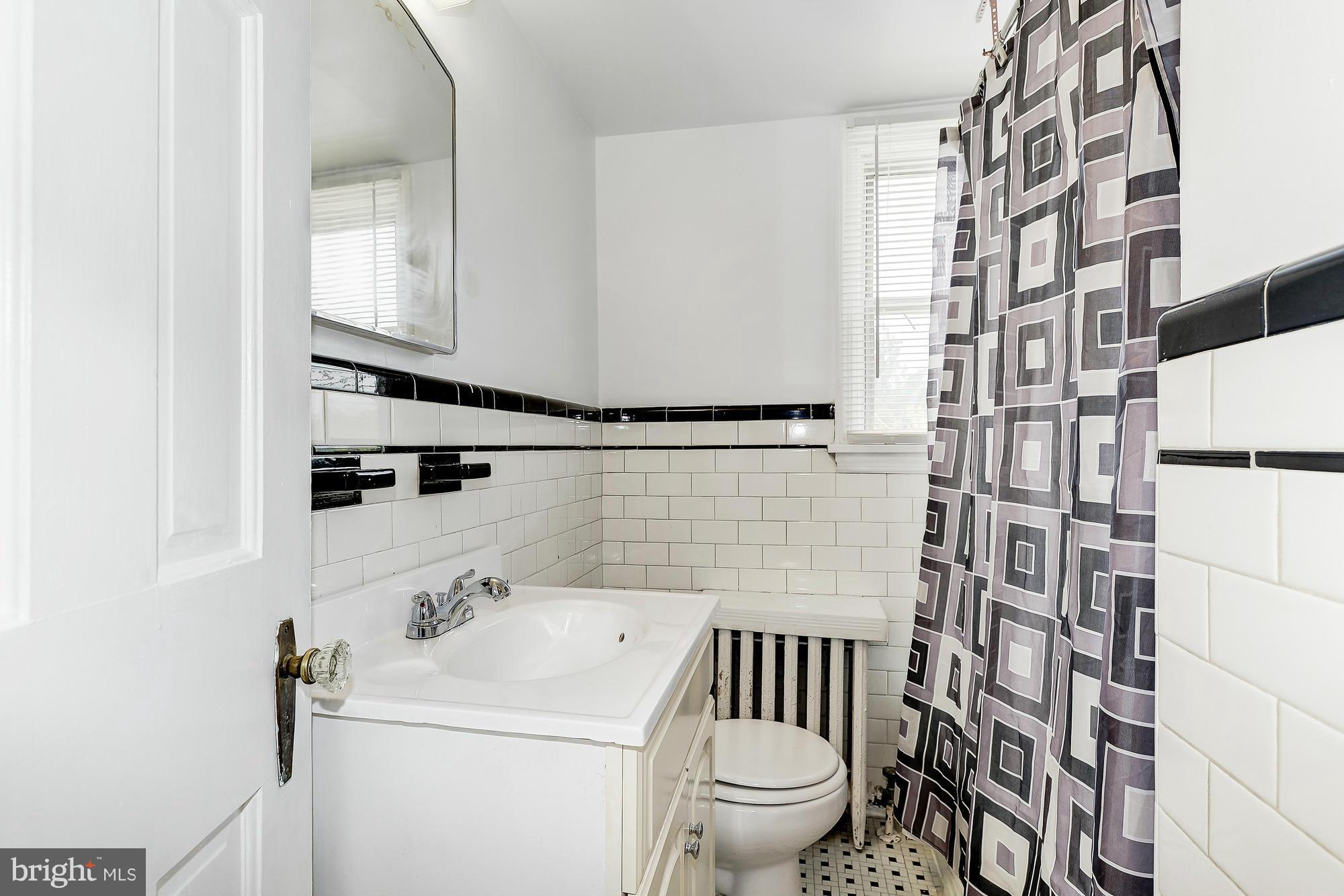 7925 Liberty Road Baltimore, MD 21244 - Photo 22 of 30 a bathroom with a sink toilet and shower
