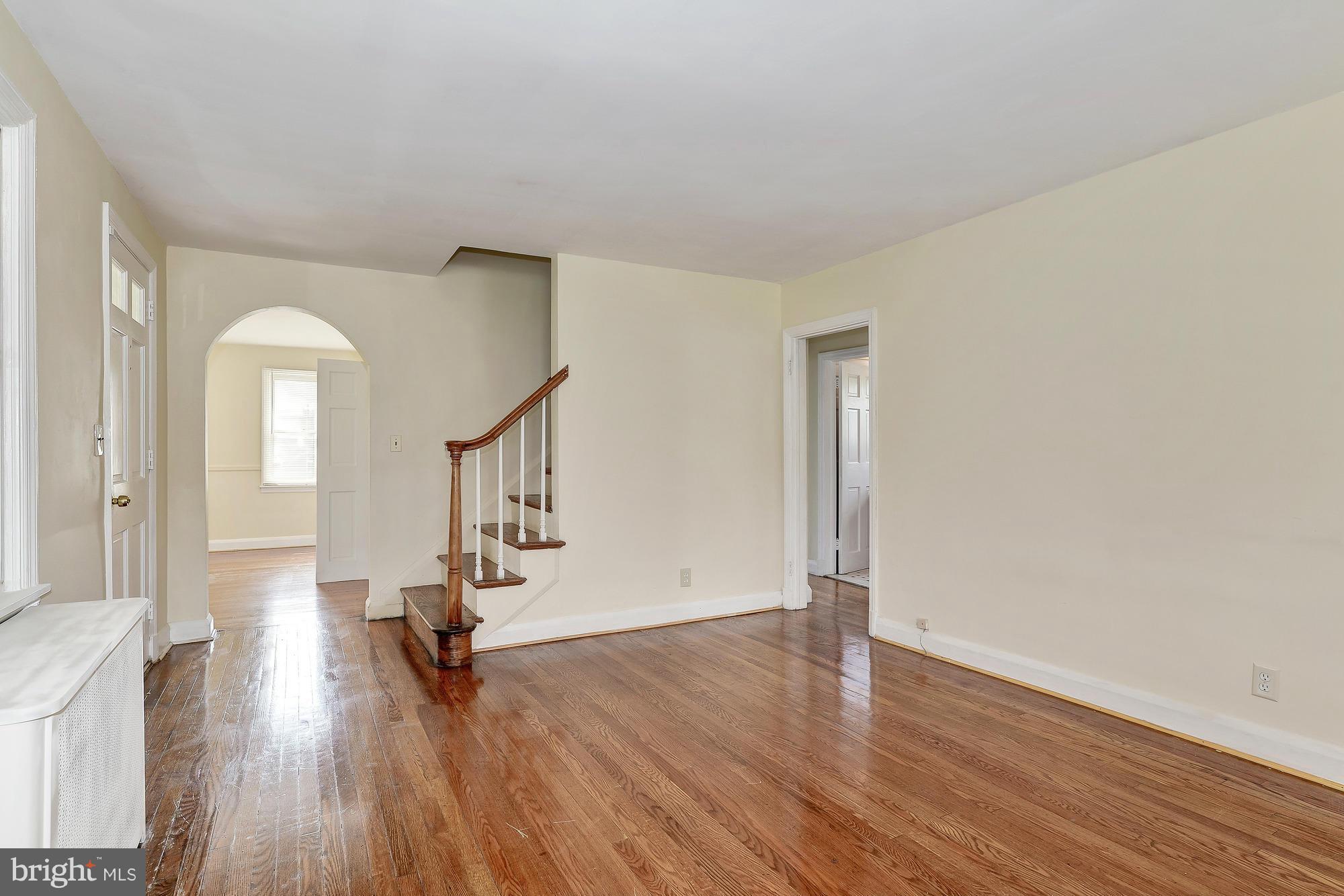 7925 Liberty Road Baltimore, MD 21244 - Photo 6 of 30 a view of empty room with wooden floor and fan