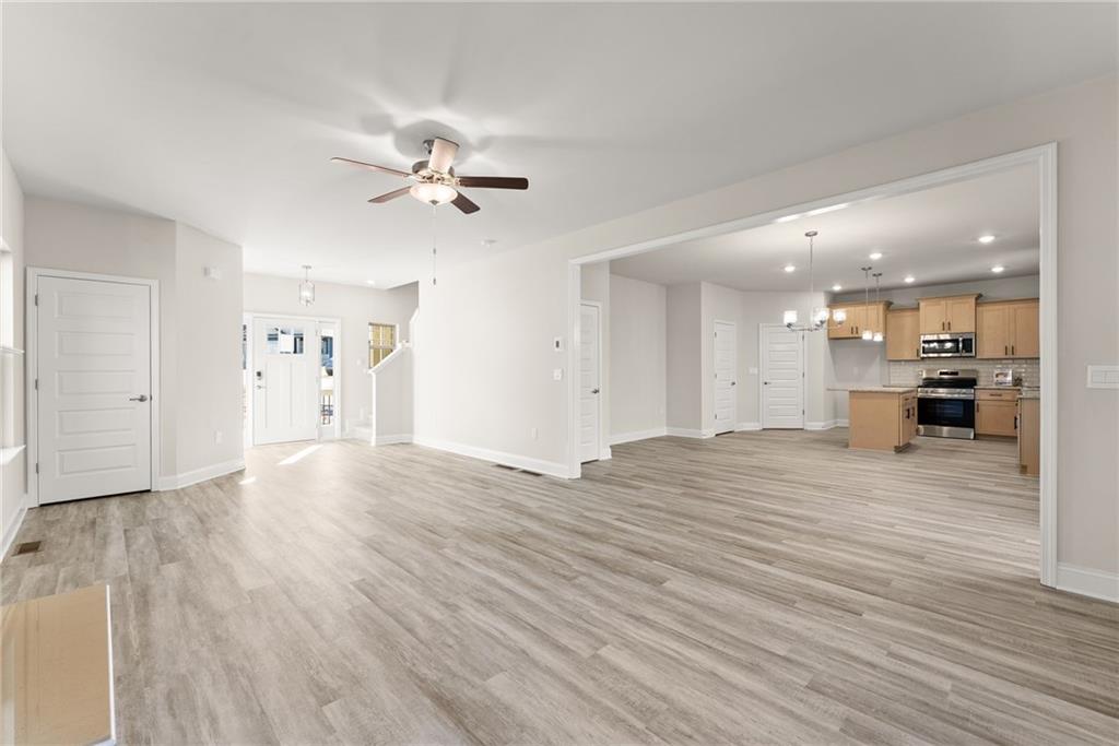 662 Forest Way Cornelia, GA 30531 - Photo 11 of 54 a view of an empty room and kitchen view