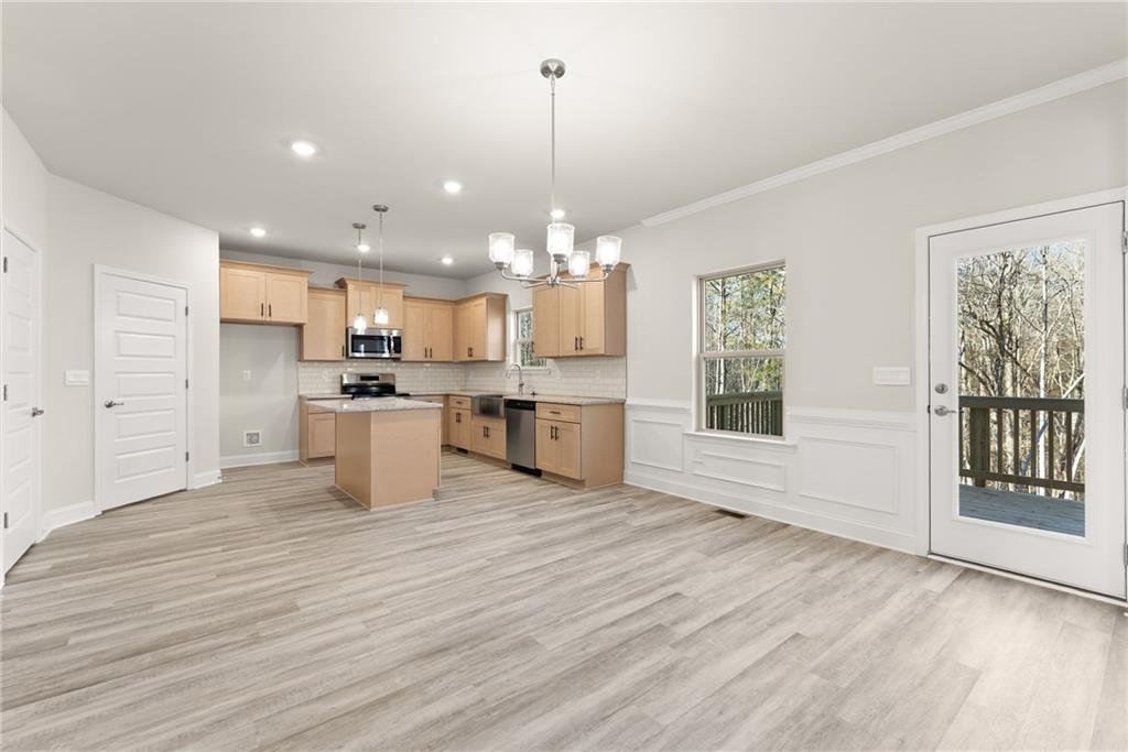 662 Forest Way Cornelia, GA 30531 - Photo 13 of 54 a view of a kitchen with granite countertop stainless steel appliances and a window