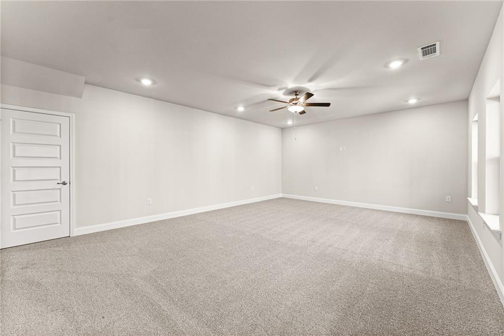 662 Forest Way Cornelia, GA 30531 - Photo 43 of 54 a view of an empty room with a ceiling fan