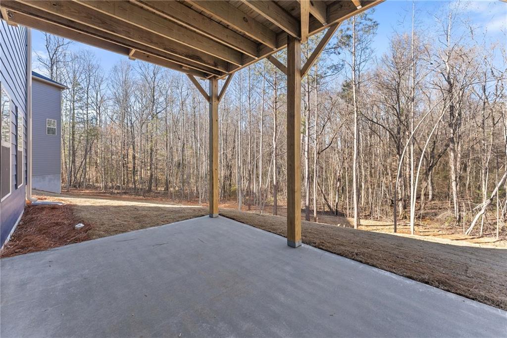 662 Forest Way Cornelia, GA 30531 - Photo 45 of 54 a view of empty room with wooden floor and door