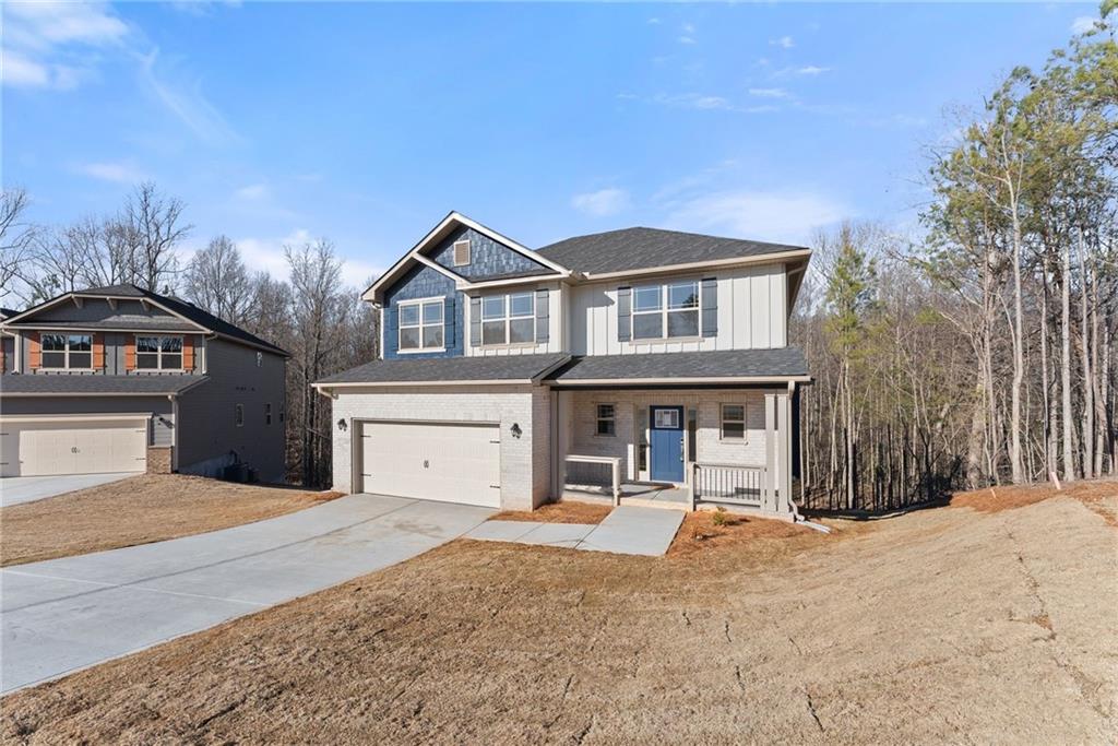 662 Forest Way Cornelia, GA 30531 - Photo 6 of 54 a front view of a house with a yard