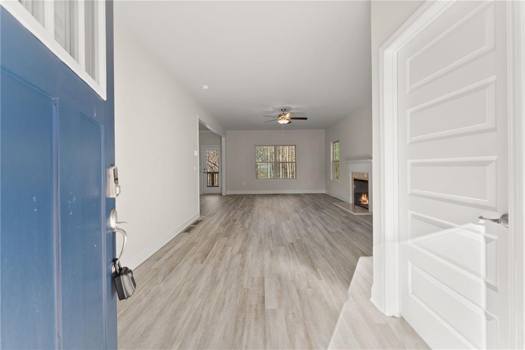 662 Forest Way Cornelia, GA 30531 - Photo 8 of 54 a view of empty room with wooden floor