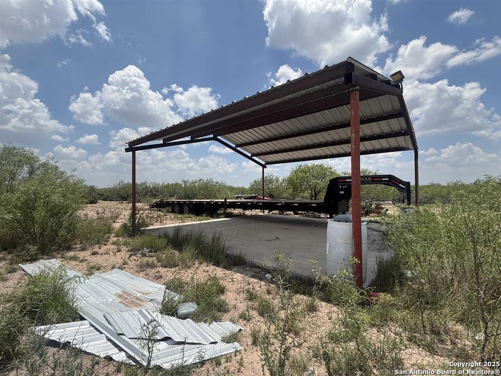 446 Ranch Road Laredo, TX 78043 - Photo 5 of 10 a roof deck with table and chairs under an umbrella