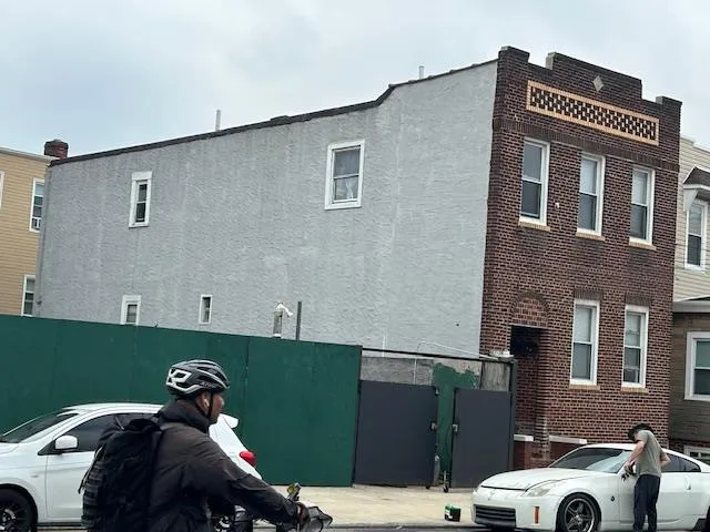 a view of a car parked in front of a building