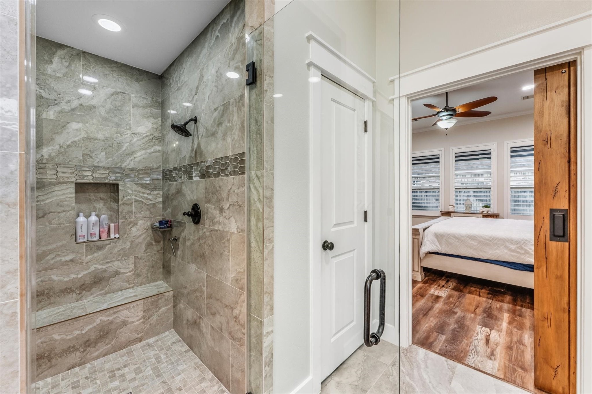 103 Fox Rindle Road Montgomery, TX 77316 - Photo 18 of 44 A walk in shower wrapped in floor to ceiling tile delivers a striking, high end finish with an unmistakably luxurious feel.