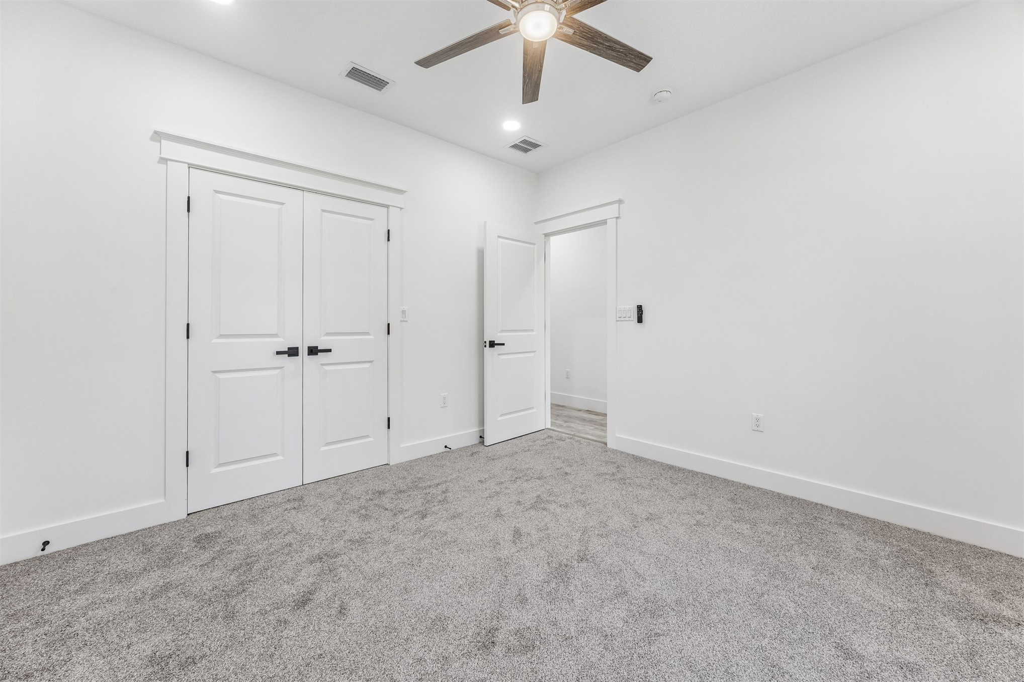 95121 North Ellis Landing Road Fernandina Beach, FL 32034 - Photo 25 of 37 an empty room with a ceiling fan and a window