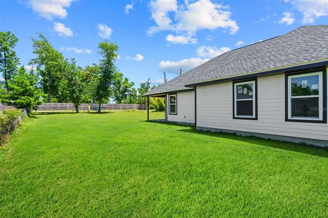a backyard of a house with lots of green space