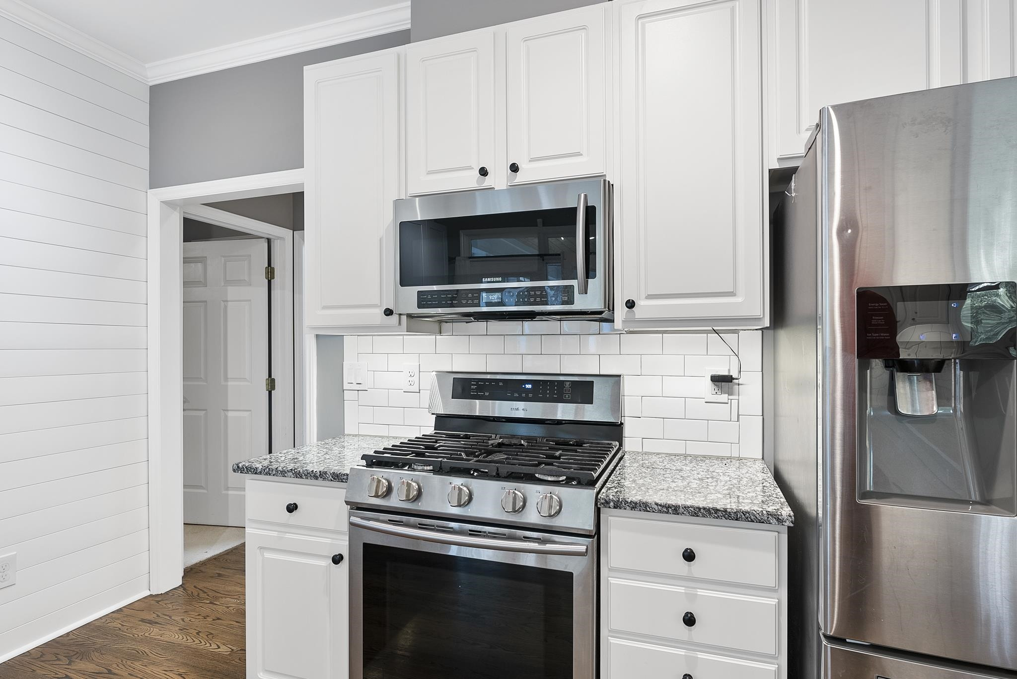15 Otters Run Durham, NC 27712 - Photo 12 of 46 a kitchen with stainless steel appliances a stove a microwave and a refrigerator