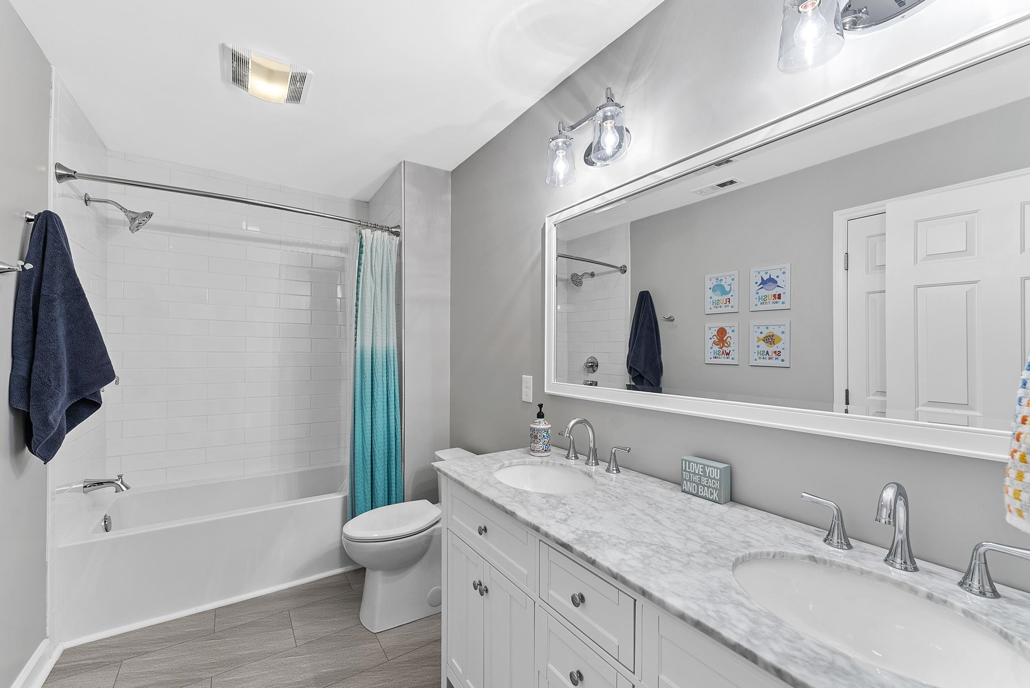 15 Otters Run Durham, NC 27712 - Photo 23 of 46 a bathroom with a granite countertop tub sink toilet and mirror