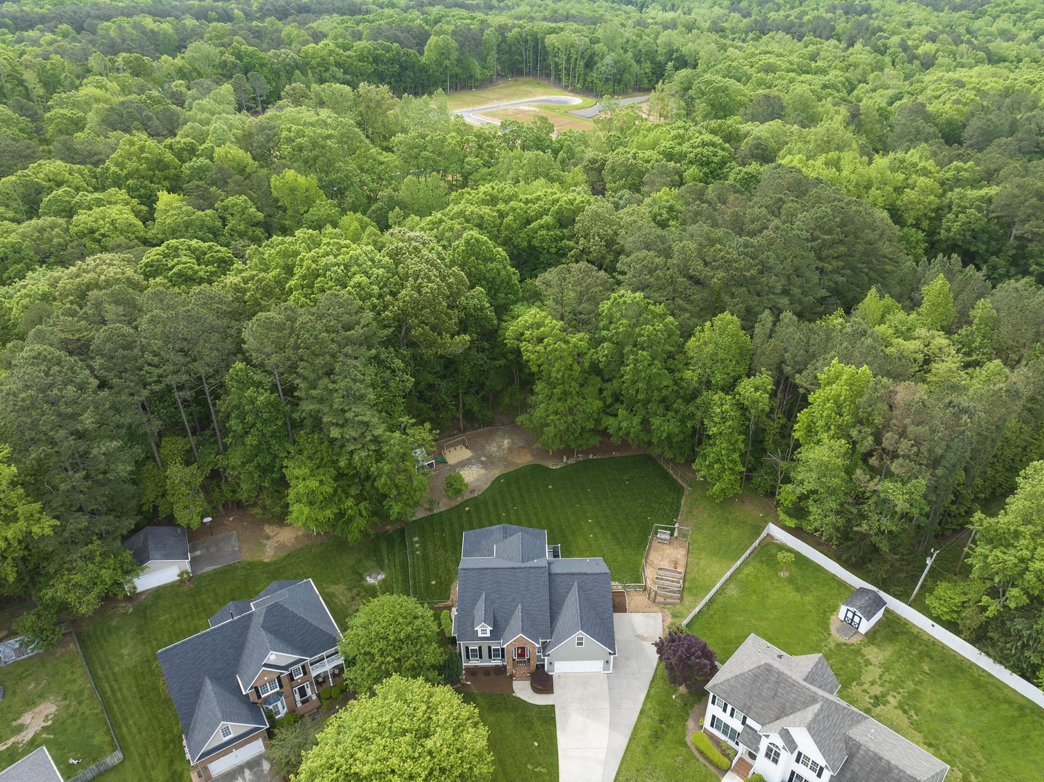 15 Otters Run Durham, NC 27712 - Photo 43 of 46 an aerial view of a house with a yard and pool