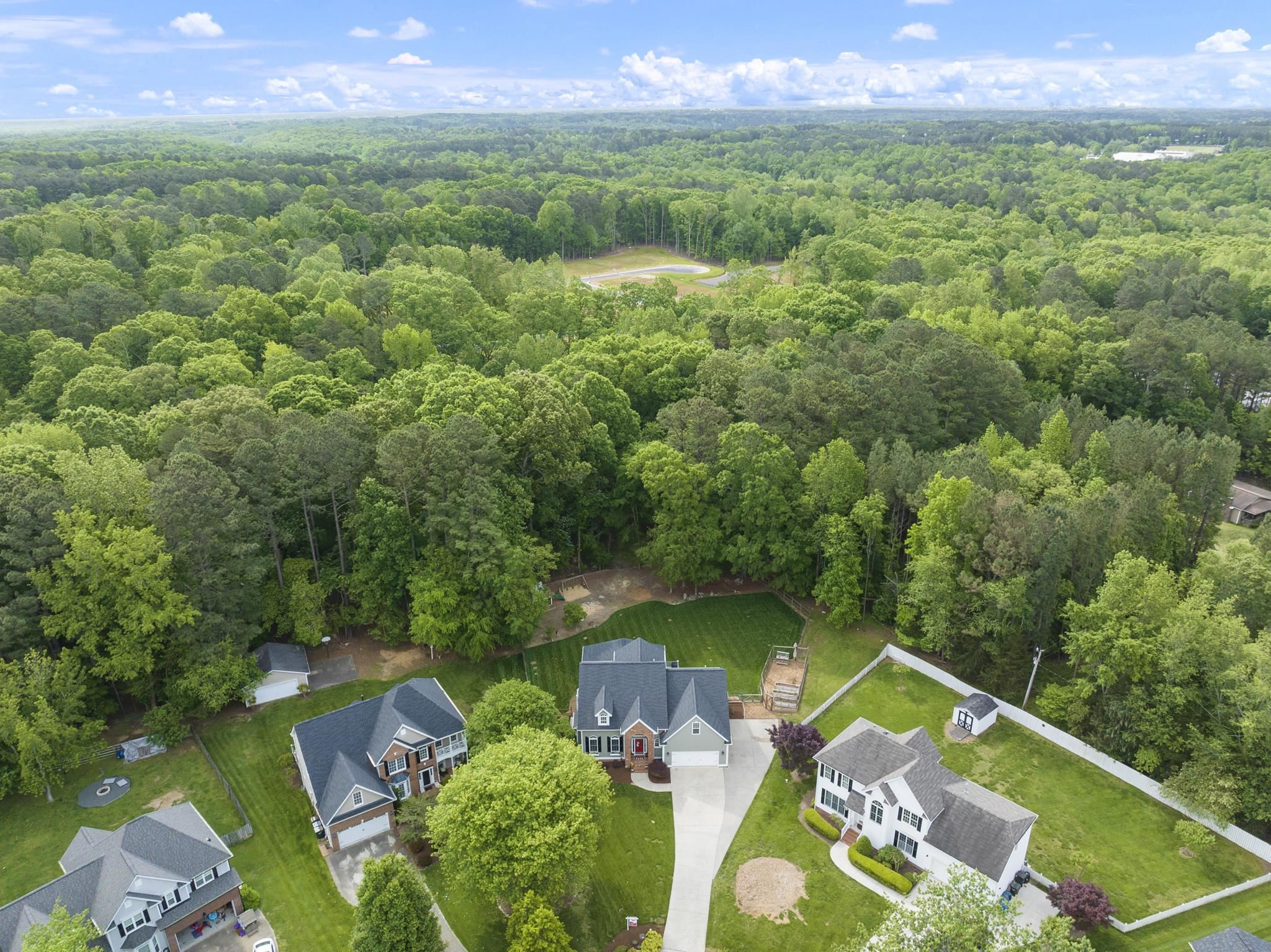 15 Otters Run Durham, NC 27712 - Photo 45 of 46 an aerial view of residential house with outdoor space and trees all around