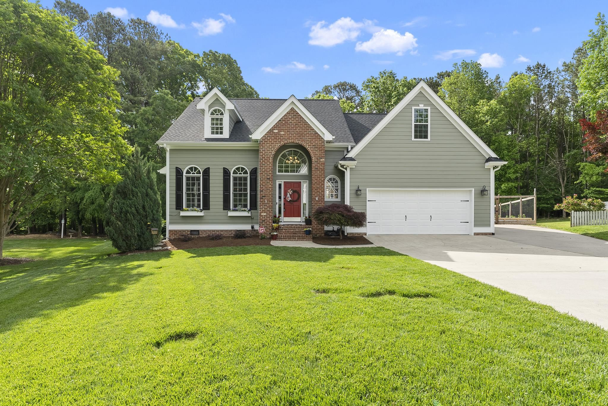 15 Otters Run Durham, NC 27712 - Photo 46 of 46 a front view of a house with a yard and porch