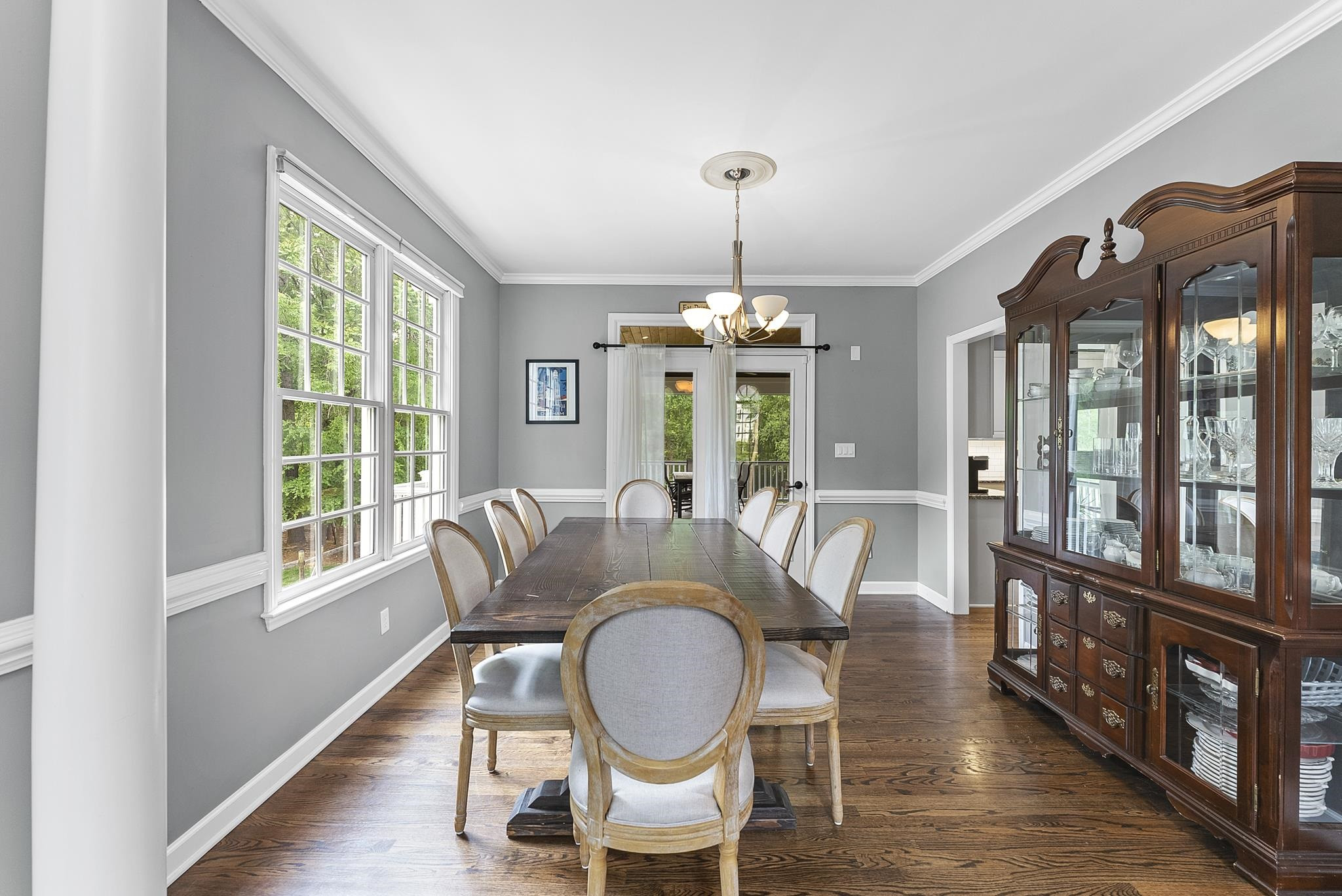 15 Otters Run Durham, NC 27712 - Photo 6 of 46 a dining room with furniture a chandelier and wooden floor