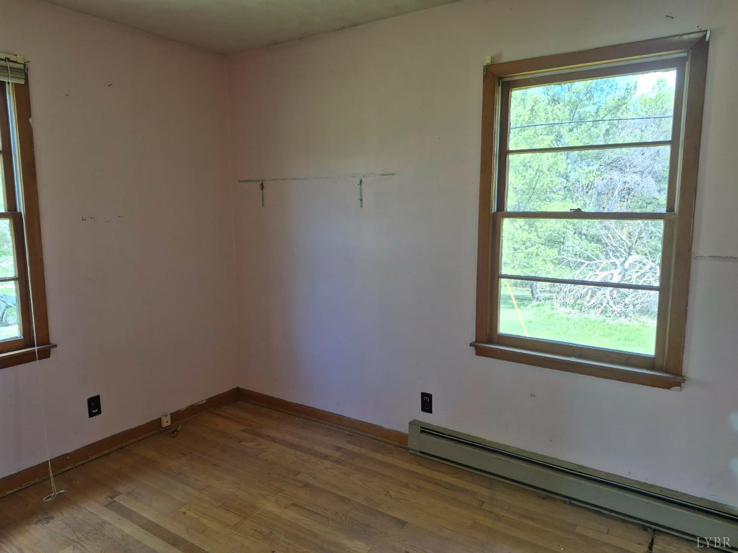 1165 Irving Road Thaxton, VA 24174 - Photo 15 of 20 a room with window and wooden floor