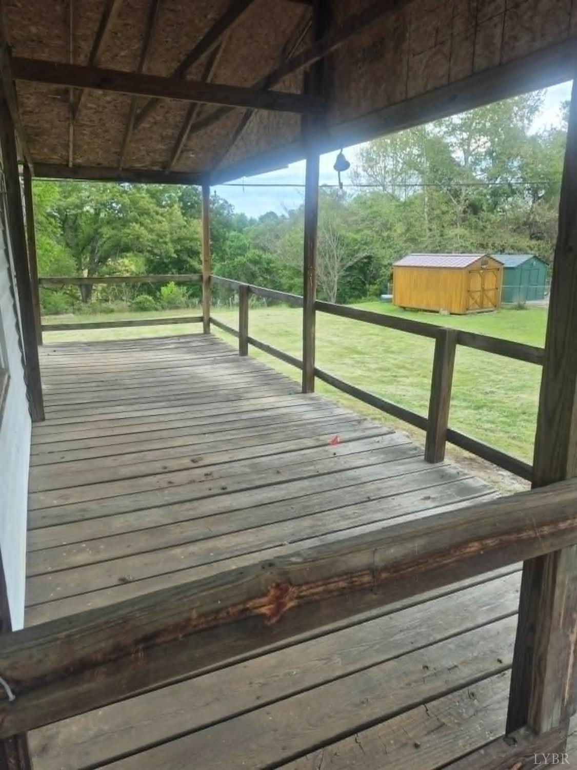 1165 Irving Road Thaxton, VA 24174 - Photo 9 of 20 a view of a porch with wooden floor and outdoor space