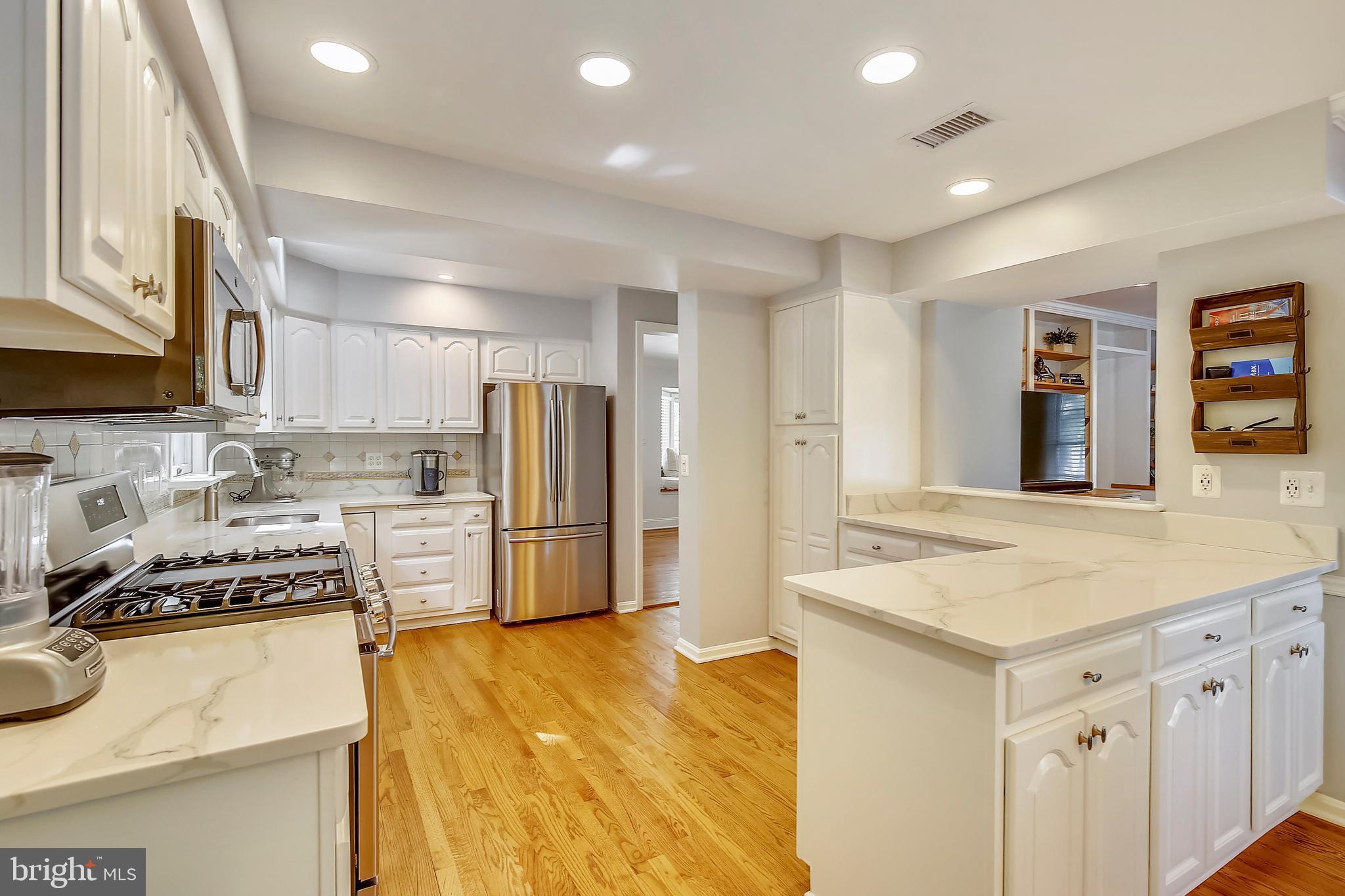 9929 Woodburn Road Silver Spring, MD 20901 - Photo 7 of 33 Updated White Kitchen with Quartz Countertops