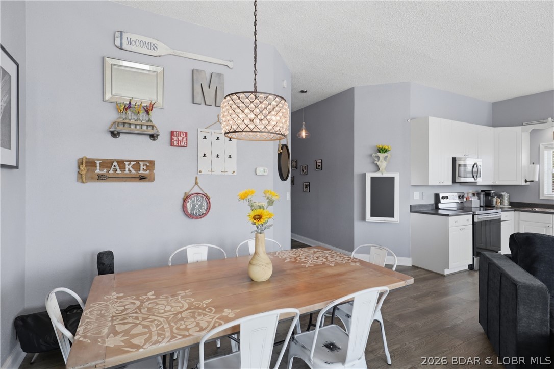 1492 Purvis Road Sunrise Beach, MO 65079 - Photo 6 of 41 Dining area in upper floor with new lighting and f