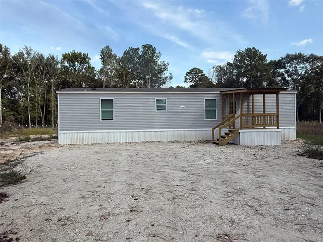 a view of a balcony with wooden floor