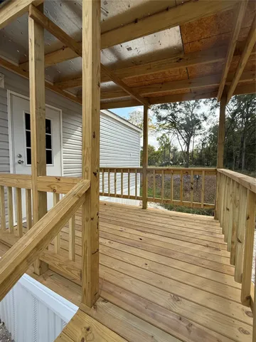 a view of outdoor space with wooden floor