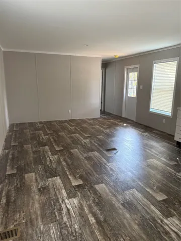 a bathroom with a toilet and a bath tub