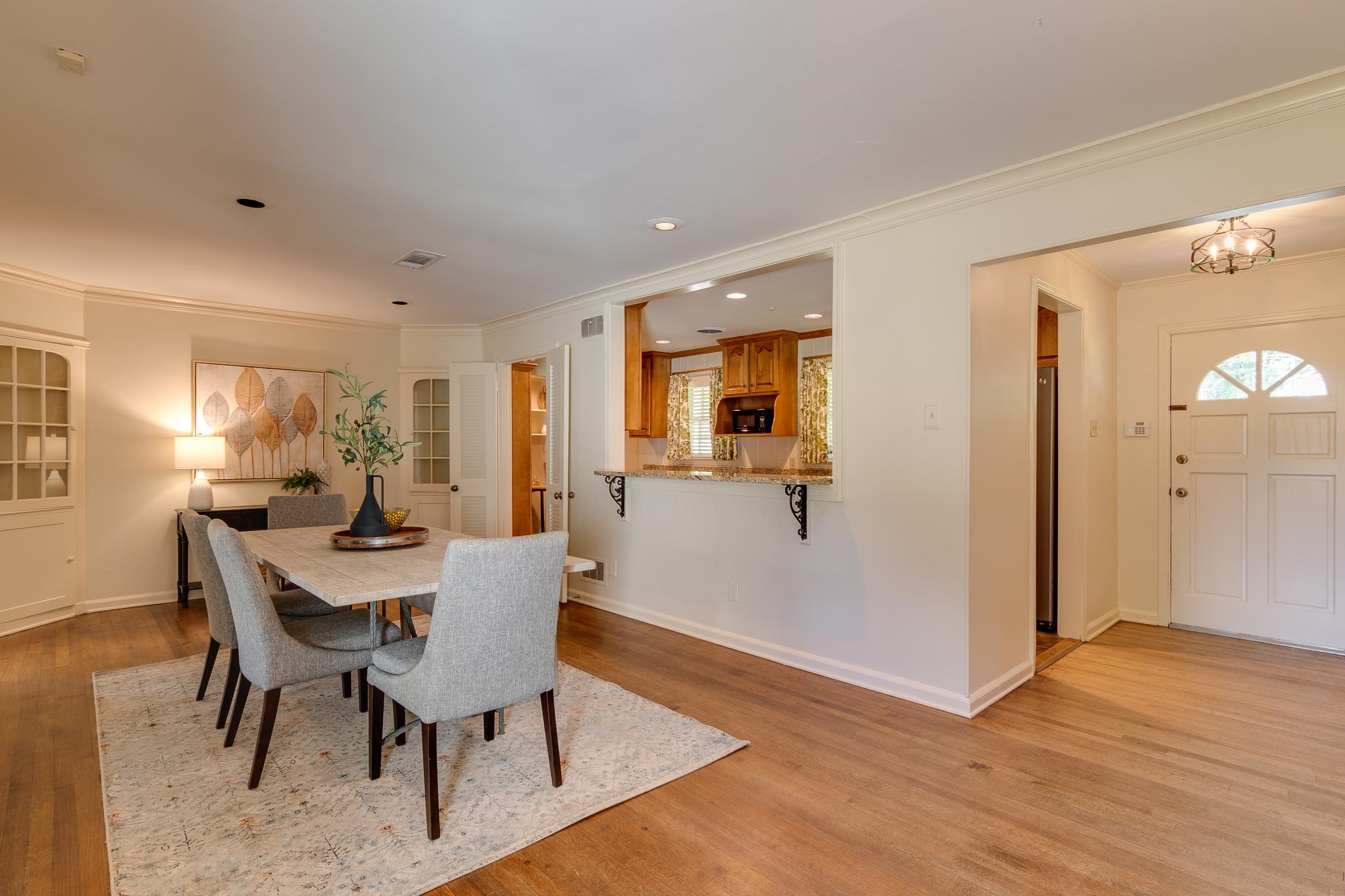 4978 Chickasaw Road Memphis, TN 38117 - Photo 5 of 28 a view of a dining room with furniture and wooden floor