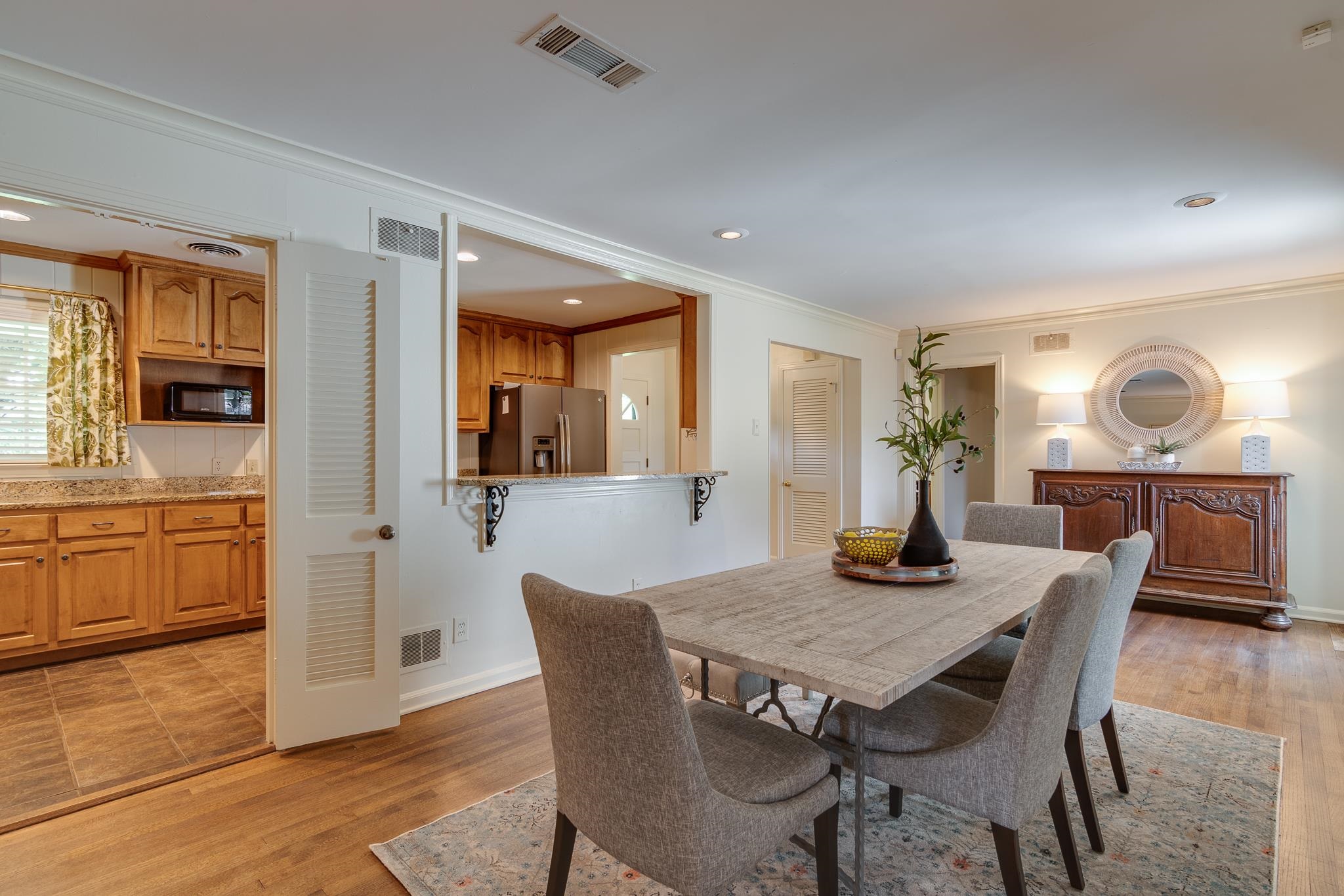 4978 Chickasaw Road Memphis, TN 38117 - Photo 6 of 28 a view of a dining room with furniture and wooden floor