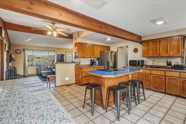 a kitchen with appliances cabinets and furniture