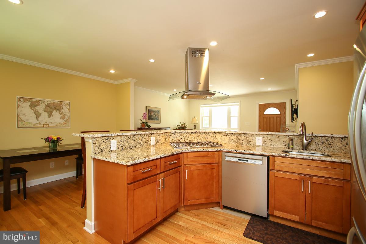 11014 Troy Road Rockville, MD 20852 - Photo 12 of 30 Gas cooktop and overhead vent hood.
