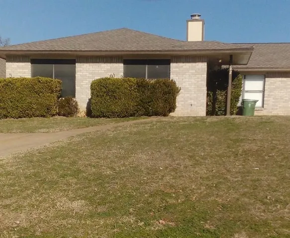 a front view of a house with a garage