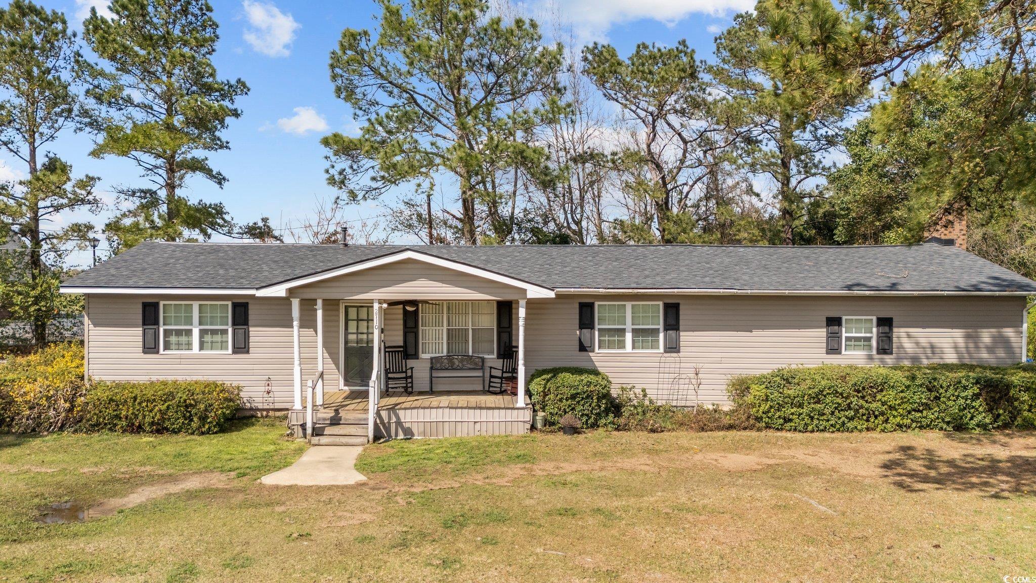 2710 Gaddys Mill Road Dillon, SC 29536 - Photo 1 of 40 Ranch-style home with roof with shingles, a porch,