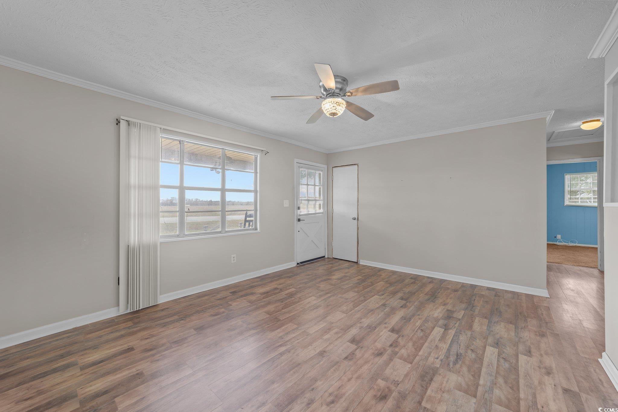 2710 Gaddys Mill Road Dillon, SC 29536 - Photo 16 of 40 Interior space featuring wood finished floors, a c