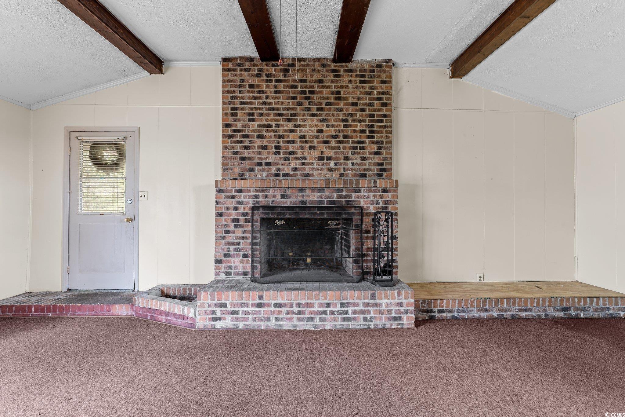 2710 Gaddys Mill Road Dillon, SC 29536 - Photo 21 of 40 Unfurnished living room with a fireplace, vaulted