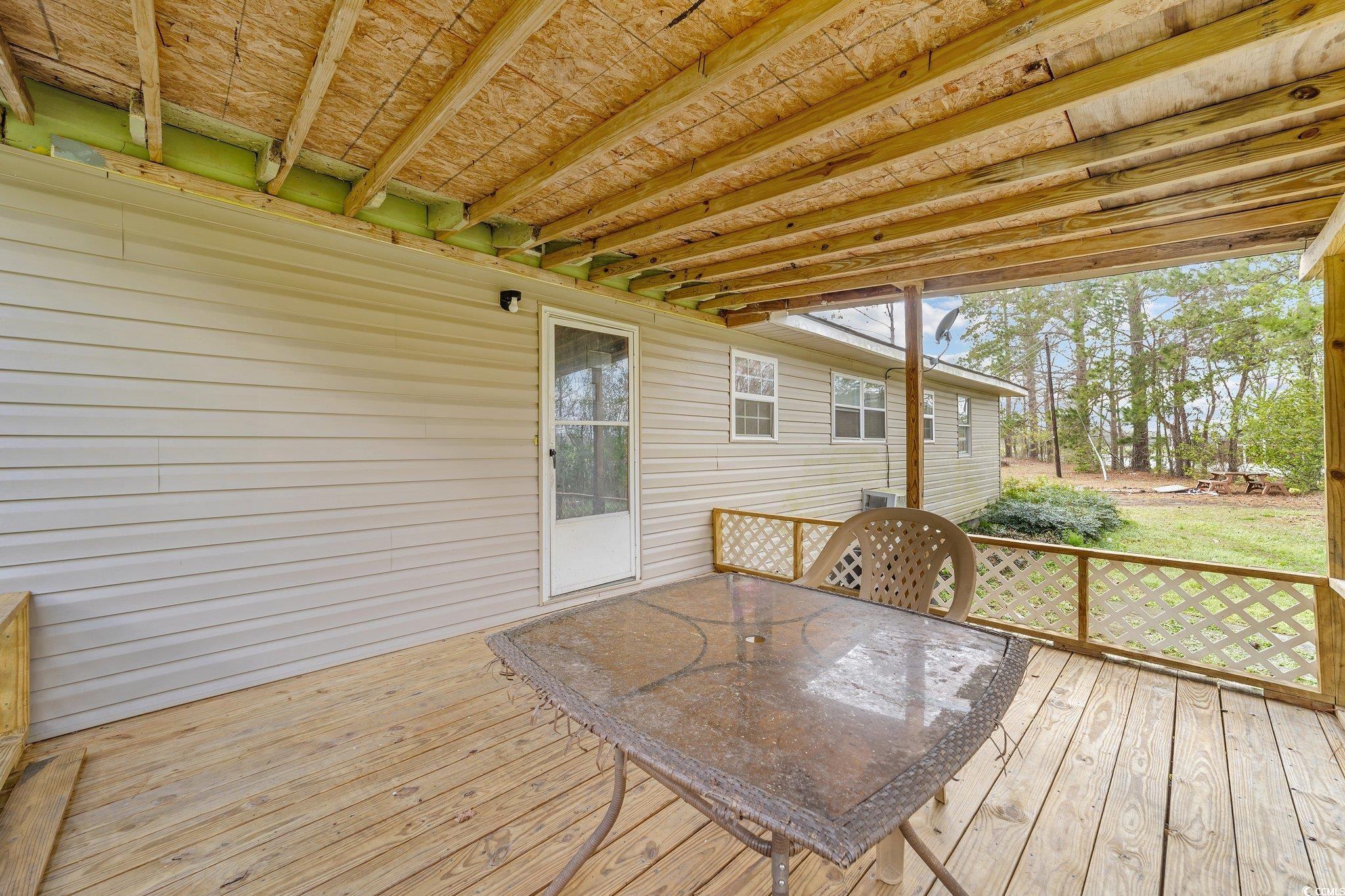 2710 Gaddys Mill Road Dillon, SC 29536 - Photo 26 of 40 Wooden deck featuring outdoor dining space