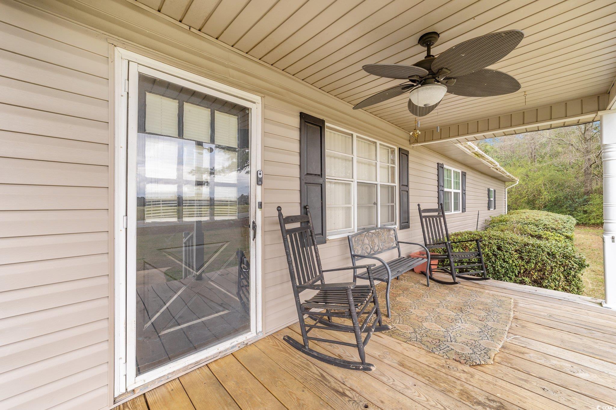 2710 Gaddys Mill Road Dillon, SC 29536 - Photo 6 of 40 Deck featuring covered porch and ceiling fan