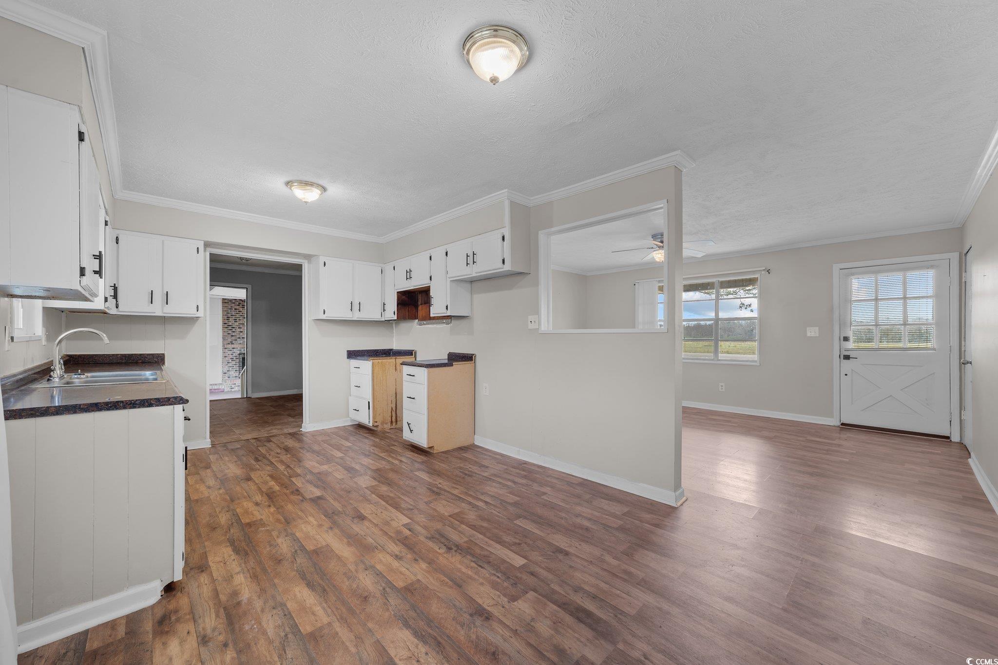 2710 Gaddys Mill Road Dillon, SC 29536 - Photo 9 of 40 Kitchen featuring a ceiling fan, dark wood finishe