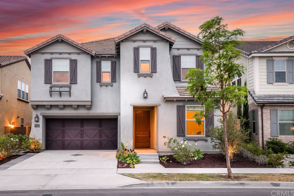 a front view of a house with yard
