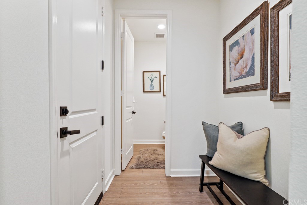 279 Barnes Road Tustin, CA 92782 - Photo 14 of 32 a hallway with furniture and a gate