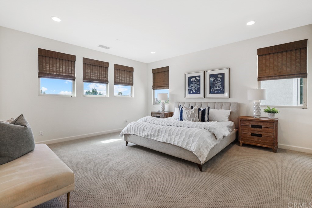 279 Barnes Road Tustin, CA 92782 - Photo 20 of 32 a spacious bedroom with a bed and a window