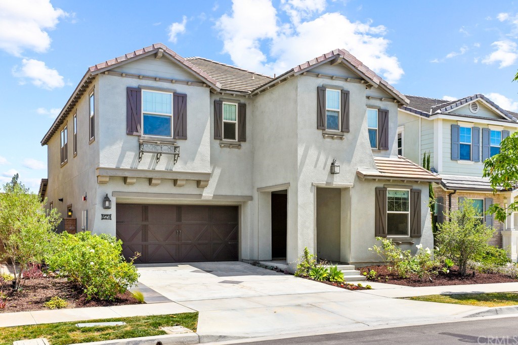 279 Barnes Road Tustin, CA 92782 - Photo 2 of 32 a front view of a house with a yard