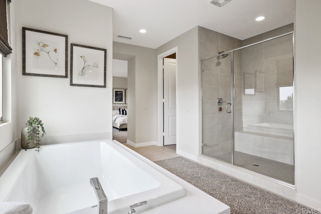 279 Barnes Road Tustin, CA 92782 - Photo 22 of 32 a room with a bath tub and shower