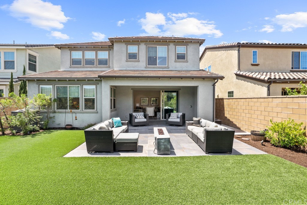 279 Barnes Road Tustin, CA 92782 - Photo 26 of 32 a view of a house with a deck and furniture