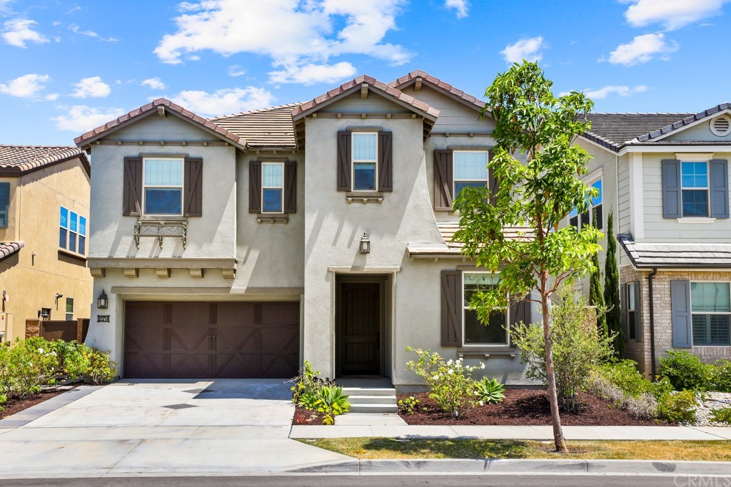 279 Barnes Road Tustin, CA 92782 - Photo 29 of 32 a front view of a house with a garden