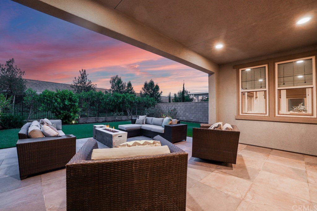 279 Barnes Road Tustin, CA 92782 - Photo 30 of 32 a outdoor living space with couch and a potted plant