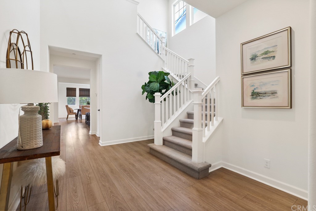 279 Barnes Road Tustin, CA 92782 - Photo 3 of 32 a view of entryway and hall with wooden floor