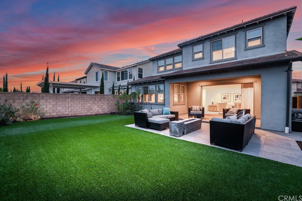 279 Barnes Road Tustin, CA 92782 - Photo 32 of 32 a view of a house with a backyard and patio