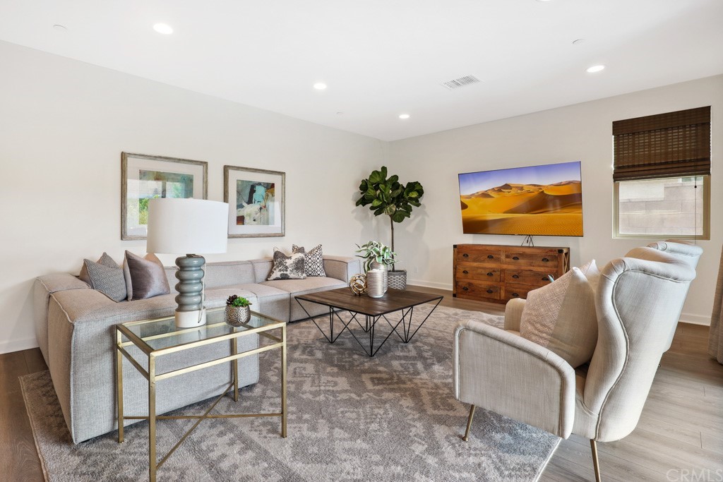 279 Barnes Road Tustin, CA 92782 - Photo 7 of 32 a living room with furniture and a flat screen tv