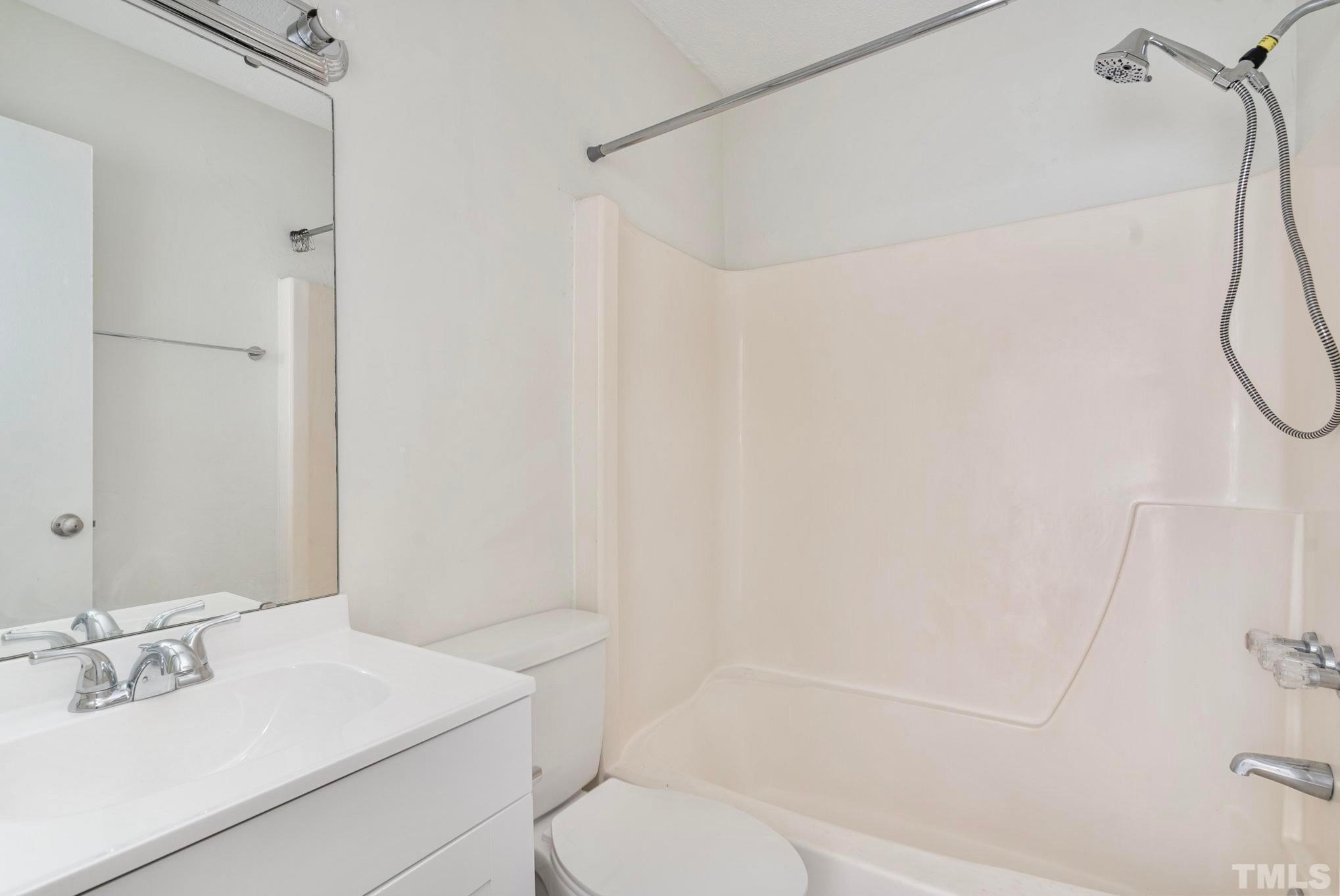 5073 Tall Pines Court Raleigh, NC 27609 - Photo 17 of 21 a bathroom with a sink toilet and shower