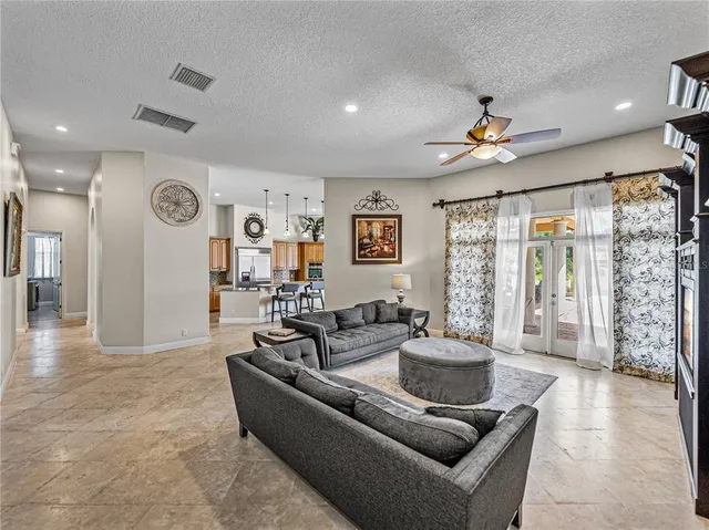 a view of a dining room with furniture and chandelier